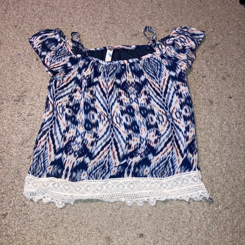 A blue, white, and peach color off shoulder top.